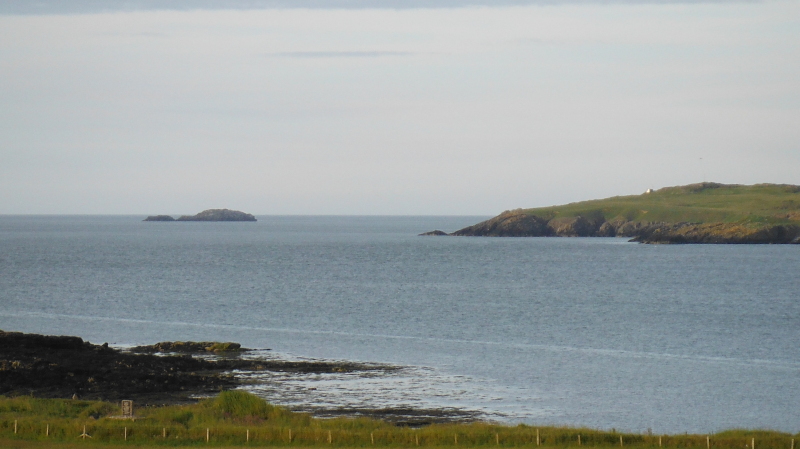 looking out from Cemlyn to Middle Mouse and Wylfa Head 