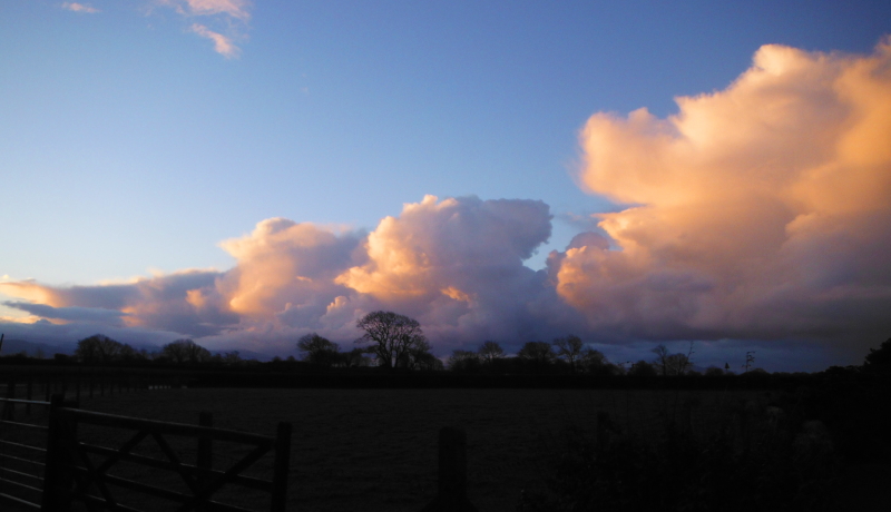  the clouds catching the early morning sun 