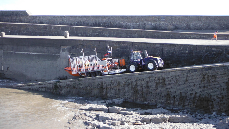  the tractor and trailer heading up the ramp