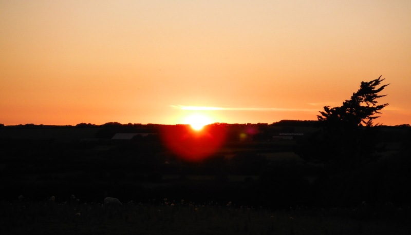  the sun dropping down below the horizon 