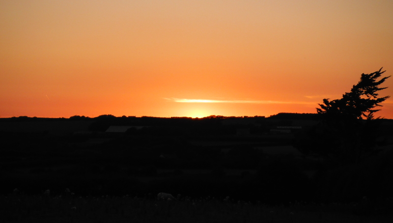  the small area of afterglow just above the horizon 