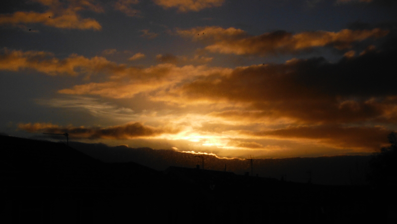  the sunset over the rooftops 