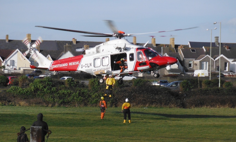  one of the RNLI people being winched up 