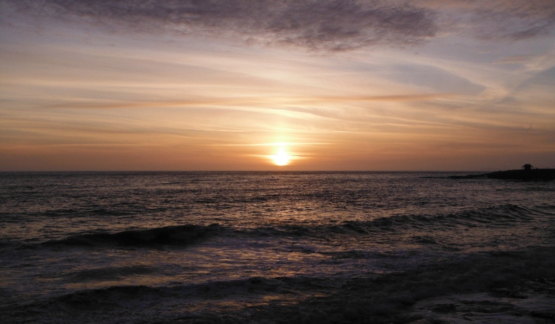  the sun setting over the sea 