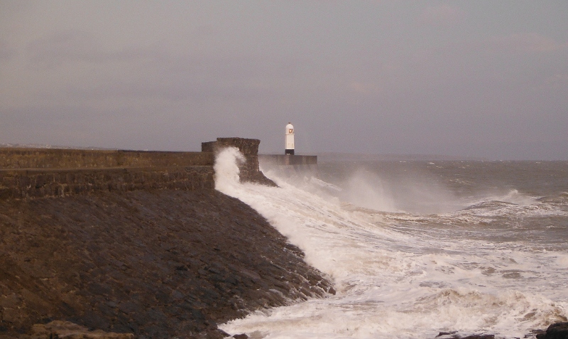  big waves crashing onto the seawall 