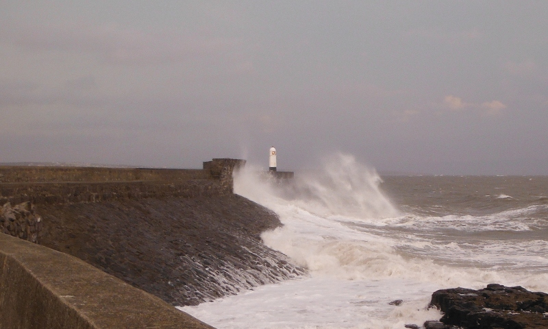  big waves crashing onto the seawall 