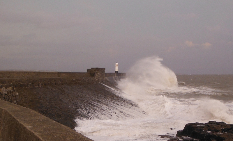  big waves crashing onto the seawall 