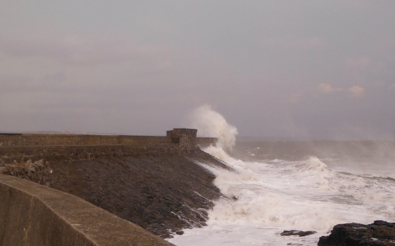  big waves crashing onto the seawall 