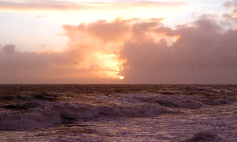  the sun trying to get out beyond the storm clouds 