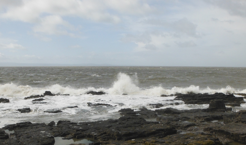  the sea crashing into the rocks 