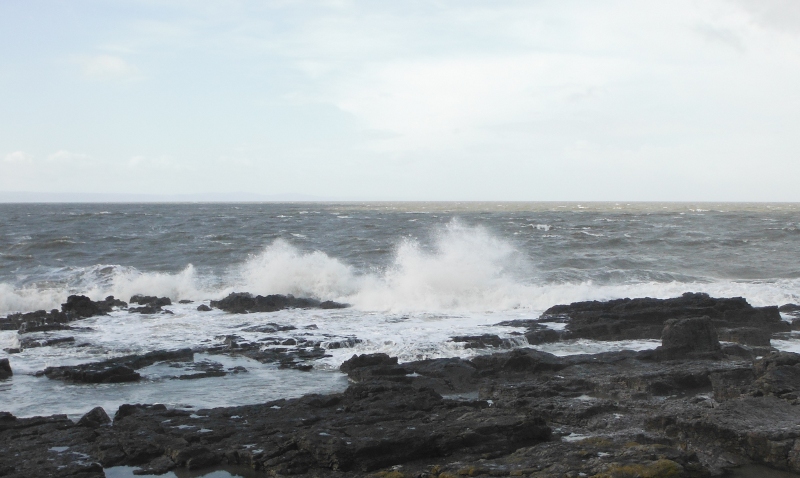  the sea crashing into the rocks 