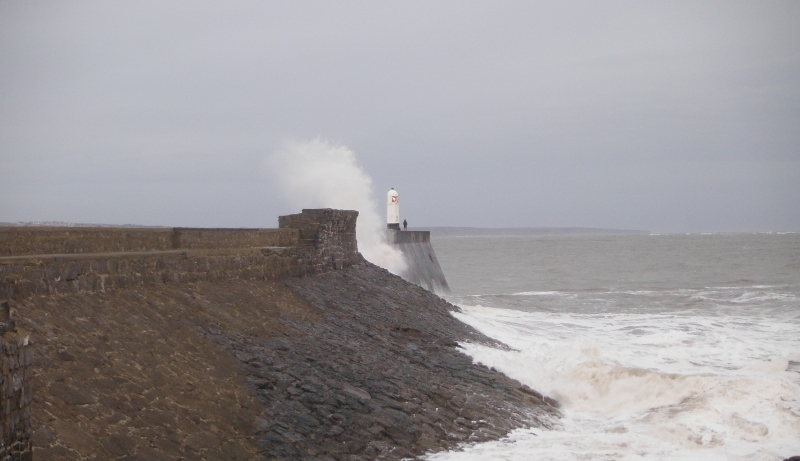  the sea crashing onto the sea wall 