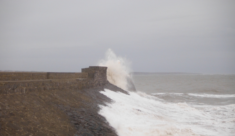  the sea crashing onto the sea wall 