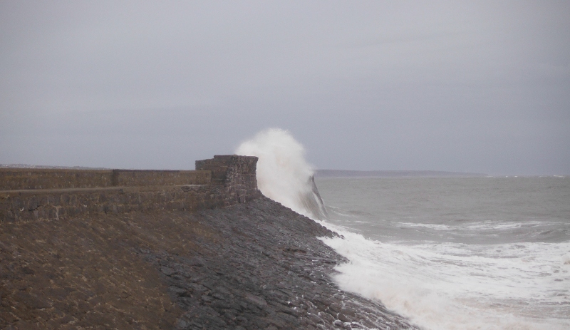  the sea crashing onto the sea wall 