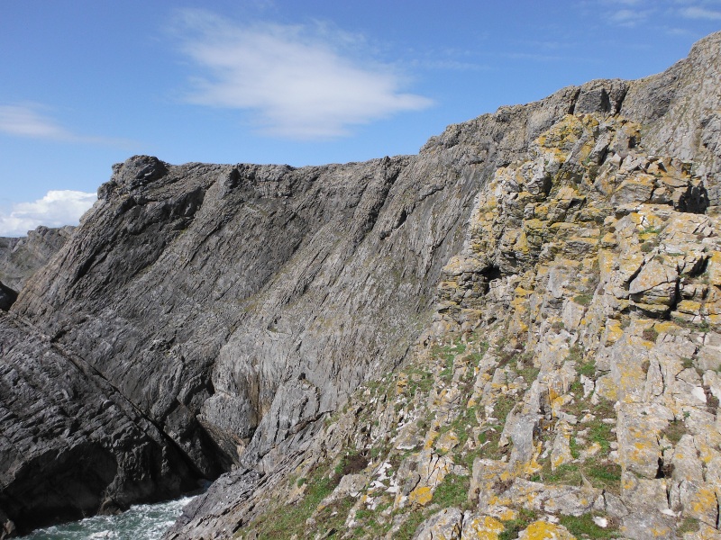  the massive rock wall above me