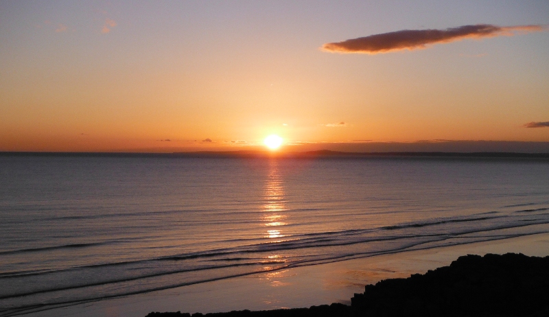  the sun setting over the Gower Peninsula 