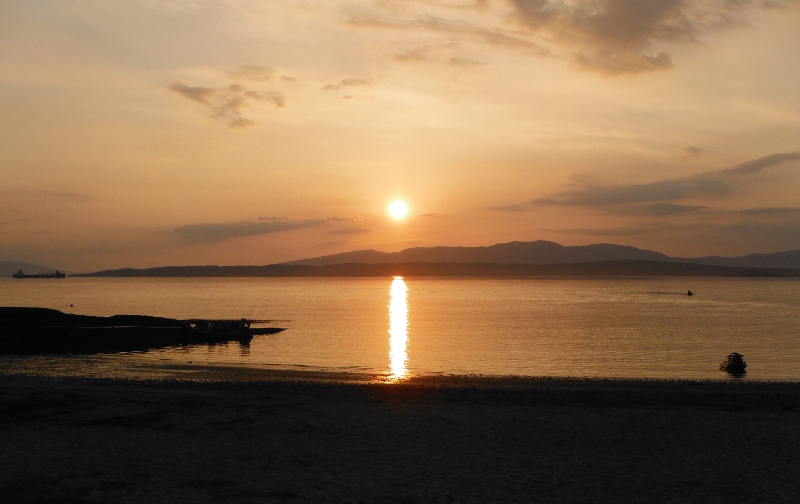  the sun setting over Lismore and Kingairloch 