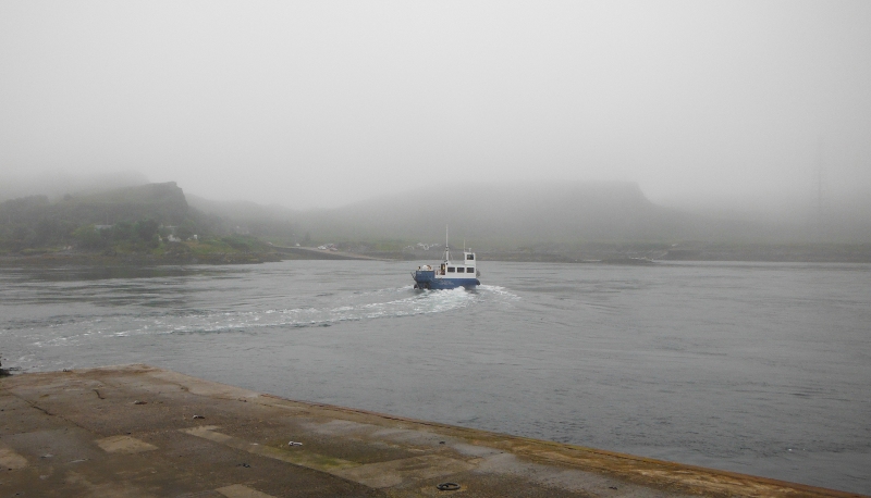  the Luing ferry heading away into the fog 