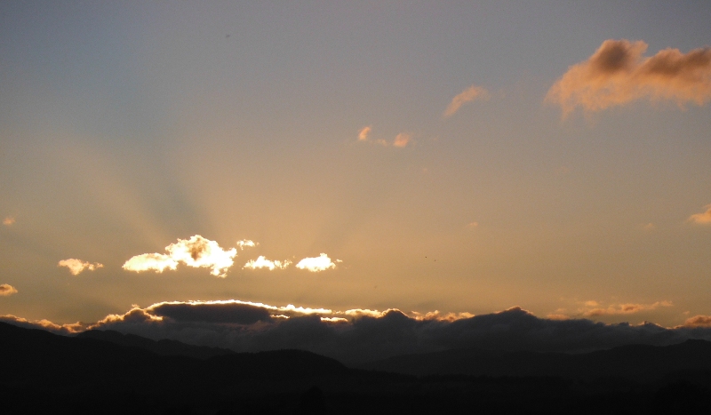  the setting sun lighting up the clouds 