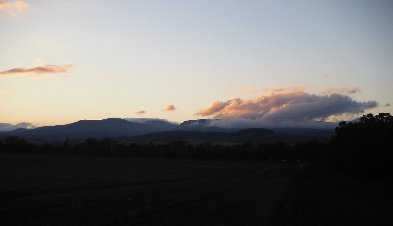  the setting sun lighting up the clouds 