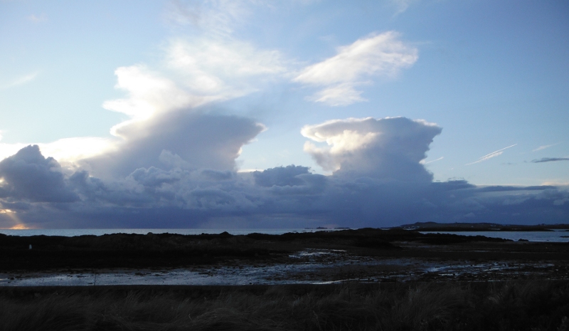  a pair of cumulonimbus clouds 