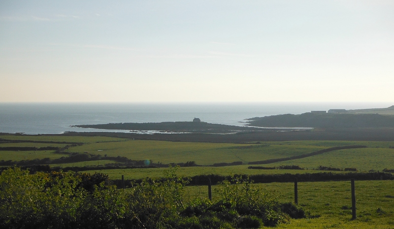  looking down on Porth Cwyfan, Porth China, and St Cwyfan`s Church 