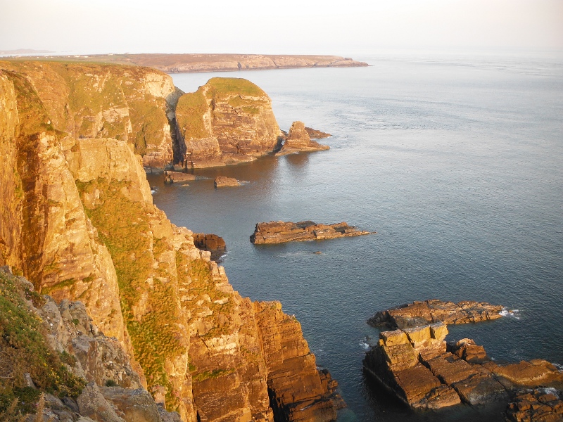  the sun still lighting up the cliffs 