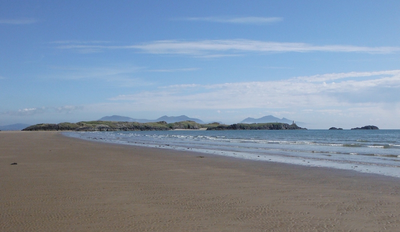  looking back along the beach to Llanddwyn Island and the mountains on the Lleyn Peninsula 