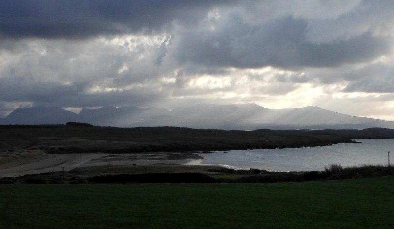  the shafts of sunlight lighting the west of the Nantlle Ridge 