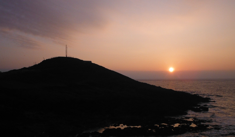  the sun just above the layer of cloud 