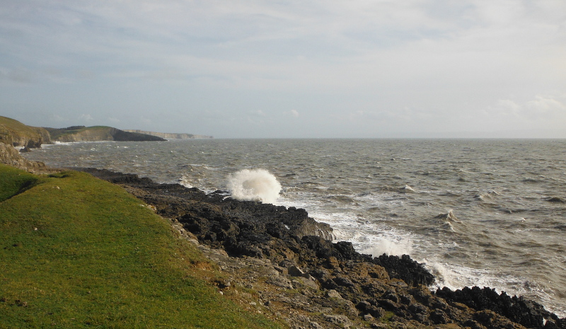  the waves blasting onto the rocks 