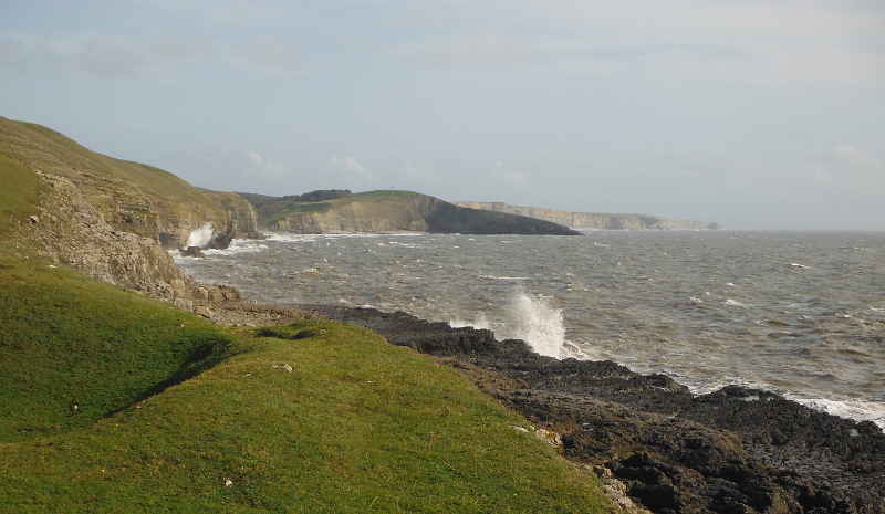  the waves blasting onto the rocks 