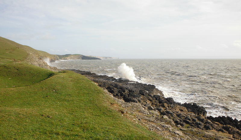  the waves blasting onto the rocks 