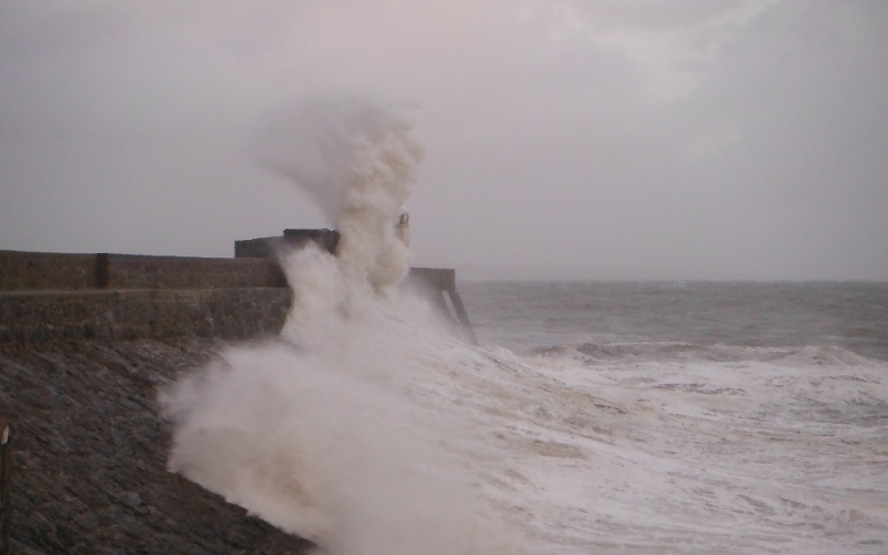  the waves crashing against the pier 