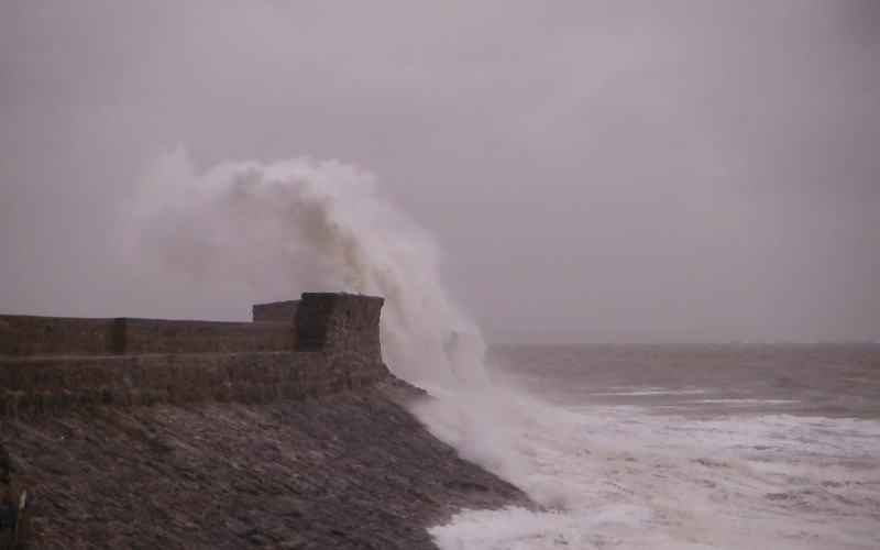  the waves crashing against the pier 