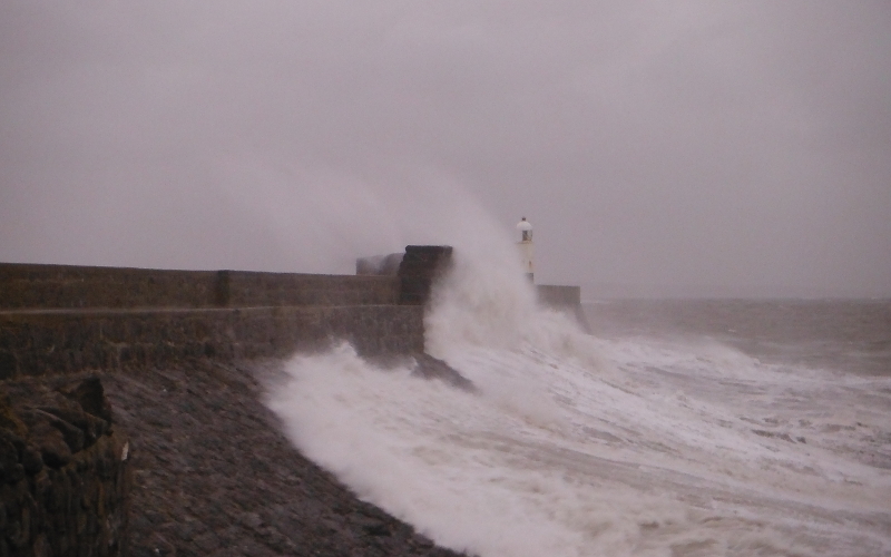  the waves crashing against the pier 