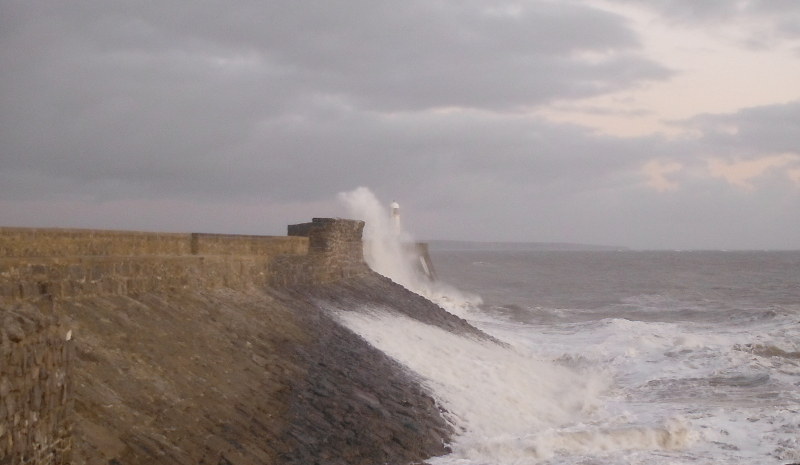  the waves crashing against the pier 