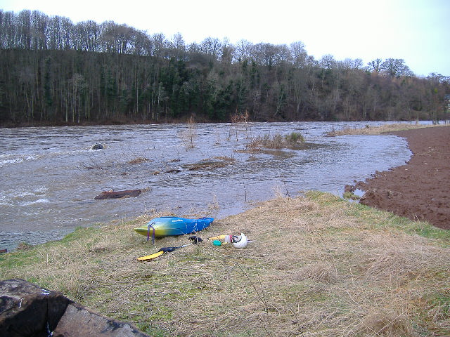 photograph of the edge of the field beside the weir